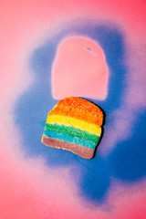 single rusk painted with rainbow colors, breakfast time, food design healthy concept