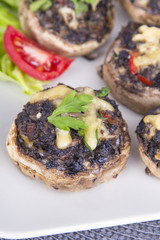 Stuffed champignons with eggs, cheese and paprika.