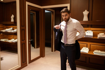 Man putting on his jacket