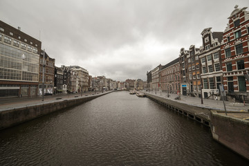 Amsterdam, March 18, 2017: Canals and house view from Amsterdam, where city of bikes, canals and peace