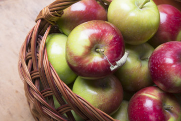 tasty organic apples in a wicker basket