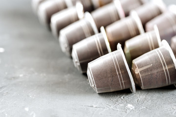 Coffee capsules for coffee machine Background with close up coffee capsules Copy space