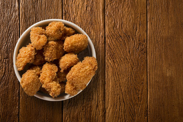 Fish fried portion on the wood background