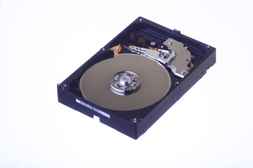 Internal view of computer hard disk isolated on white background.