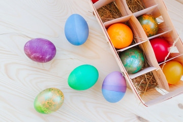 Fototapeta na wymiar multicolored Easter eggs in wooden packing