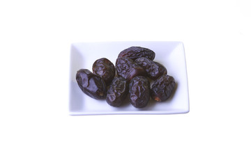 Dried dates isolated on white background.