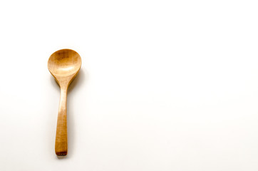 Wooden spoon on the white background