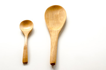 Wooden spoon and ladle on the white background