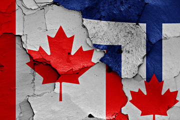 flags of Canada and Toronto painted on cracked wall © daniel0