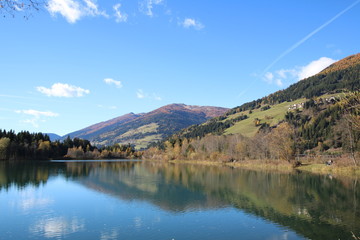 Fototapeta na wymiar Tassenbacher Speicher during Autumn / This lake is situated in Osttirol, Austria