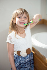 Little girl brushing teeth