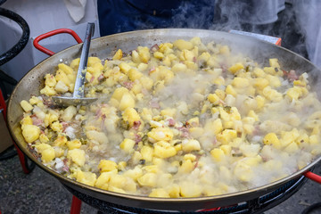 Fried potatoes in an iron pan