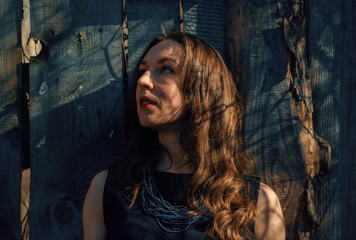 Girl in the shadow of spring branches