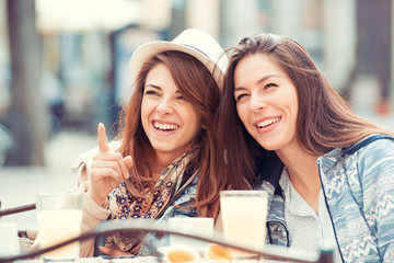 Two beautiful women chatting