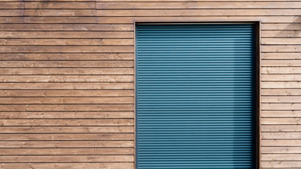 modern wooden siding with aluminum shutters