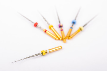 Isolated Dental Pro Tapers set for root canal treatment. White background - obrazy, fototapety, plakaty