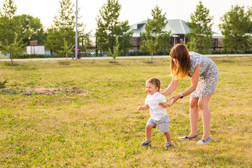 Fototapeta premium Mother and Son Having Fun in summer nature