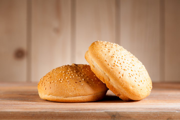 Burger buns on a rustic background