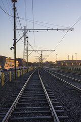 Fototapeta na wymiar Train tracks in New Orleans at sunrise