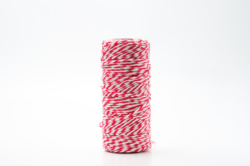 roll of Twine Red and White Stripes Cotton String isolated on white background