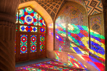 Fototapeta na wymiar OCTOBER 23, 2016 - Shiraz, the Islamic Republic of Iran : The morning sunlight shining through the stained-glass creates the great array of colors projected into the prayer halls.
