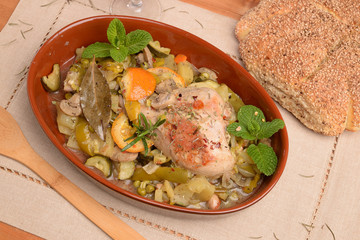 Terracotta with turkey thigh contour pepper potatoes and zucchini orange
