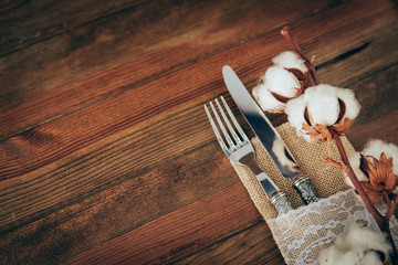 Rustic table setting over wooden background with copy space 