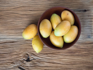 marian plum in wooden bowl
