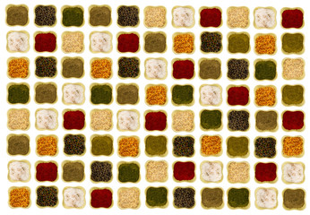 Canvas base of spices bright delicious on a white background ceramic bowls arranged symmetrically and smoothly