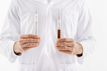 Man keeping two vials of liquid