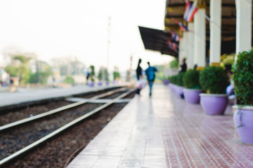 blur track railway and people on platform train station.