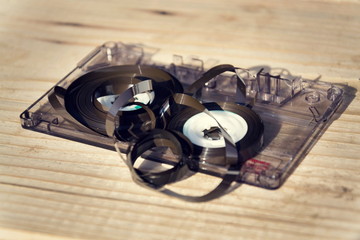 Old broken unwound compact cassette audio tape messed up
