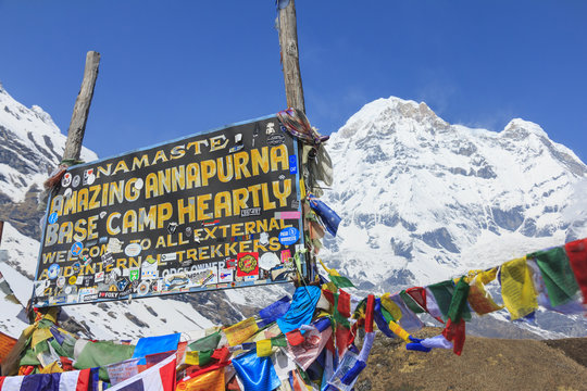 ANNAPURNA, NEPAL – APRIL 14, 2016 : Himalaya Annapurna South mountain peak with Annapurna base camp sign, there is very famous trekking destination in Nepal.