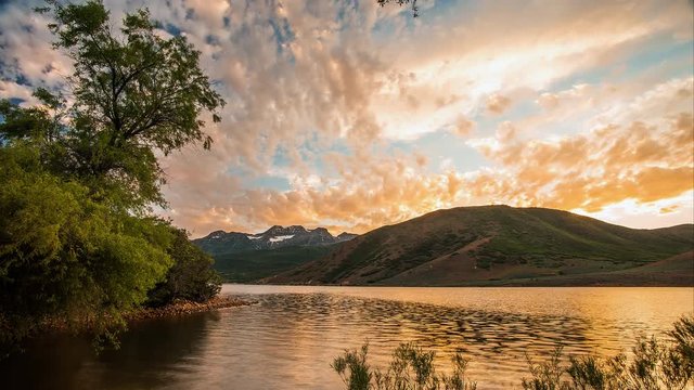 Time lapse at Deer Creek Reservoir with Timpanogos Mountain on the Horizon