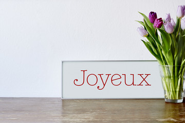 french sign and flowers on table