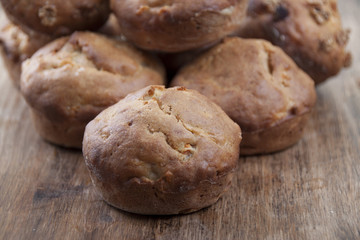 Carrot - banana cupcake in a cut closeup on a wooden table