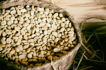 Coffee beans background vintage style iin wooden gunny bag and wooden box