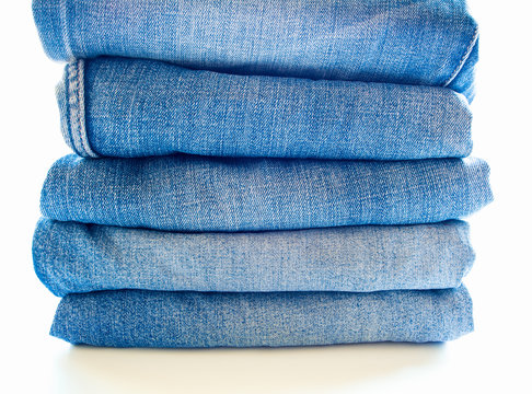 Pile of blue jeans, fabric texture
