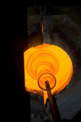 Glass furnace. Glass Blower at Work