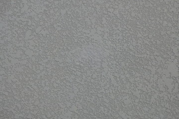 Fototapeta na wymiar Close-up to art rough texture on the grey wall