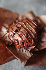 Dark chocolate muffin with cherry and sauce