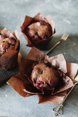 Dark chocolate muffin with cherry and sauce