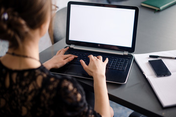 Businesswoman typing on computer