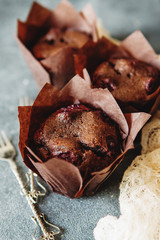 Dark chocolate muffin with cherry and sauce