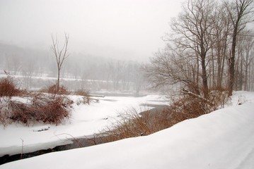 Landscape With Morning Mist and Snow Along River 