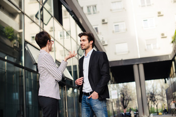 Talking about business, man and woman