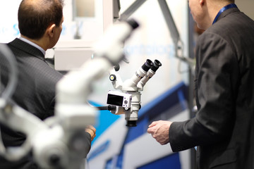Microscope on the stand of the manufacturer of optical products at the exhibition of medical equipment