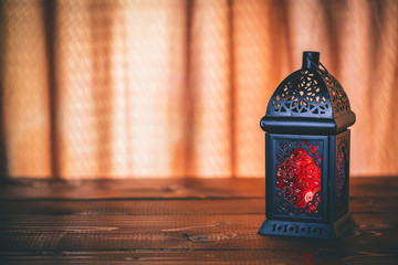 The Muslim feast of the holy month of Ramadan Kareem. Beautiful background with a shining lantern...