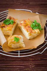 Traditional Georgian cheese layer pie Achma on wooden background. Selective focus