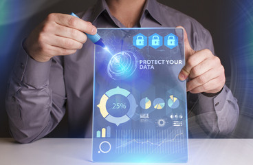 Business, Technology, Internet and network concept. Young businessman working on a virtual screen of the future and sees the inscription: Protect your data